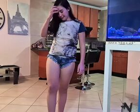 Brunette swaying her ass around and pisses in her jean shorts and gets undressed afterwards